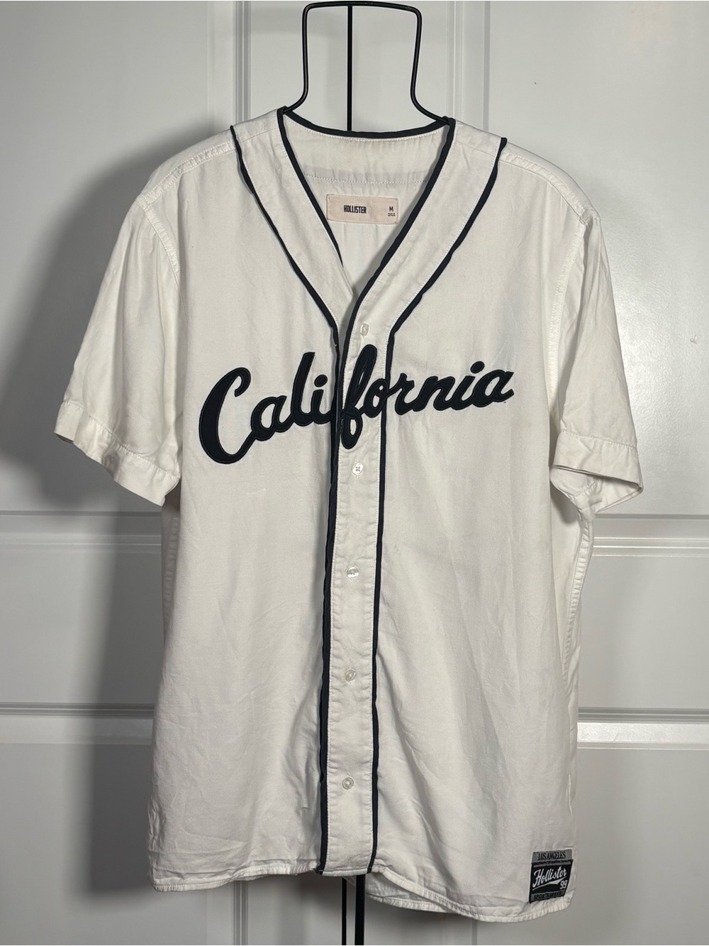Hollister White Baseball Jersey with Black Trim and California Lettering
